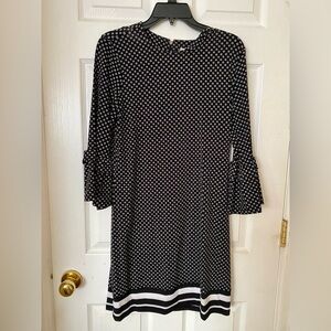 Michael Kors short dress with 3 quarter flutter sleeves.